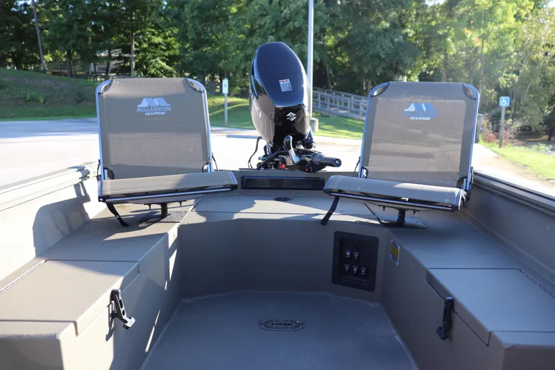 Slide: The Image of 2025 Thor 1754 Lake Hammer Tiller boat interior with two seats and motor. - 3