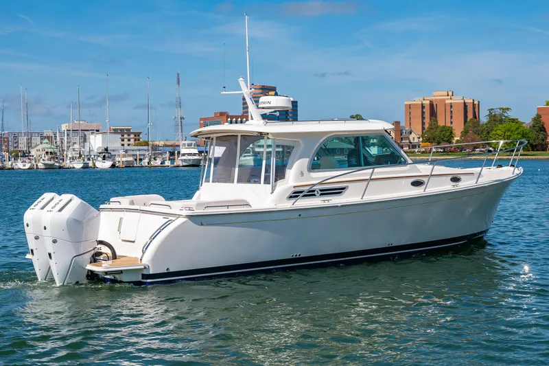 Slide: The Image of 2026 Back Cove 34O motorboat in harbor, sunny day. - 20