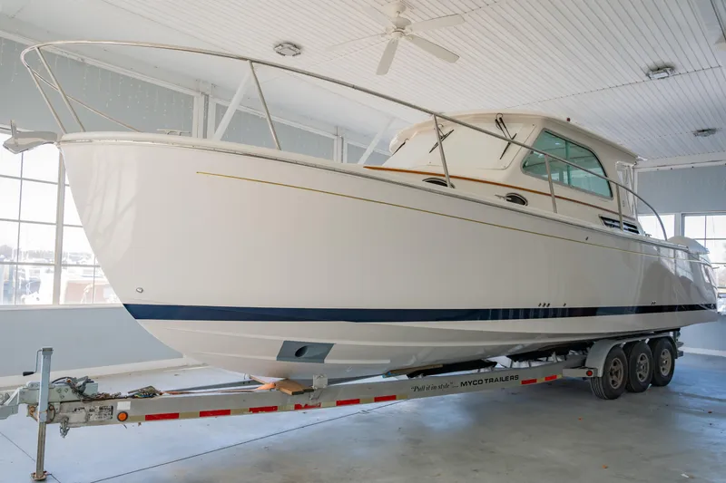 Slide: The Image of 2026 Back Cove 34O boat on trailer in indoor storage facility. - 3