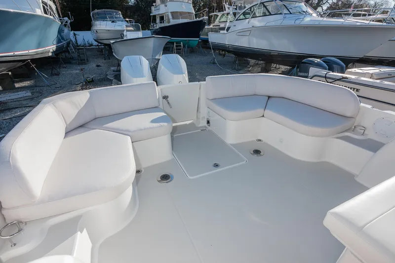 Slide: The Image of 2026 Back Cove 34O boat with spacious seating area and twin engines. - 5