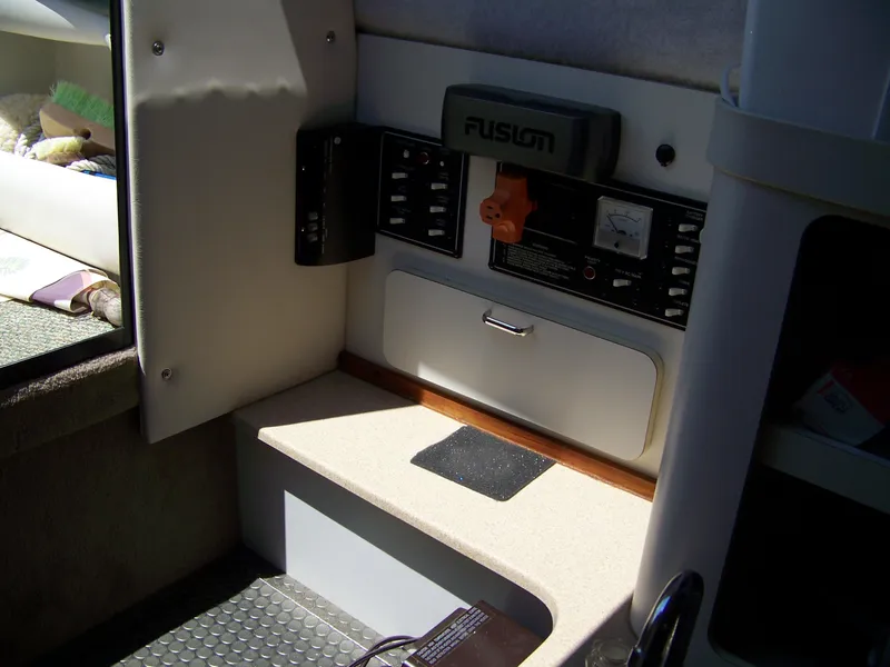 Slide: The Image of Interior view of a 1996 Crownline 250 CR boat control panel. - 12