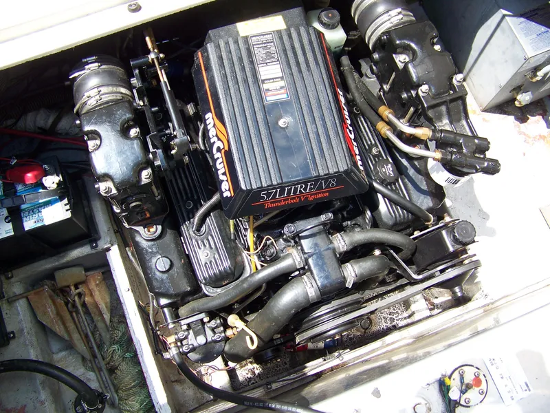 Slide: The Image of Engine compartment of a 1996 Crownline 250 CR boat with a 5.7L V8 MerCruiser engine. - 14