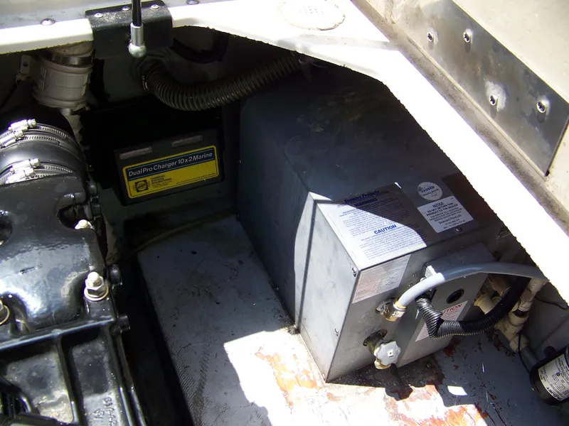 Slide: The Image of Engine compartment of 1996 Crownline 250 CR boat with DualPro Charger and equipment. - 15