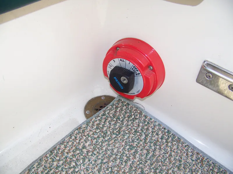 Slide: The Image of Red battery switch on 1996 Crownline 250 CR boat interior. - 17
