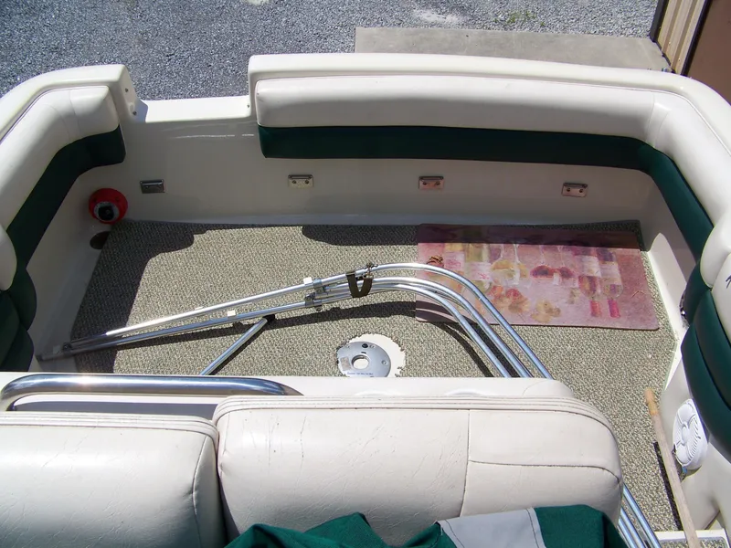 Slide: The Image of Interior of a 1996 Crownline 250 CR boat with seating and carpeted floor. - 6