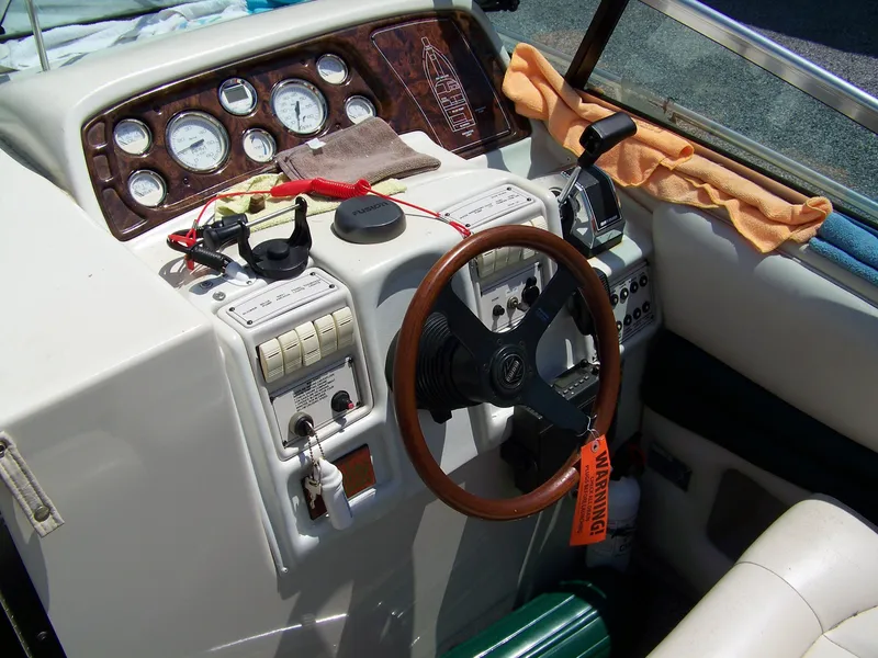 Slide: The Image of 1996 Crownline 250 CR boat dashboard with steering wheel and control panel. - 7