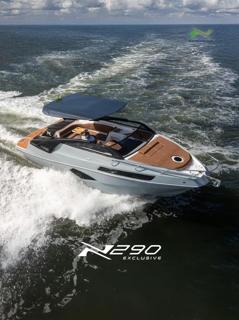 The Image of 2025 NX Boats NX290 Exclusive cruising on open water, showcasing luxury and performance. - 1