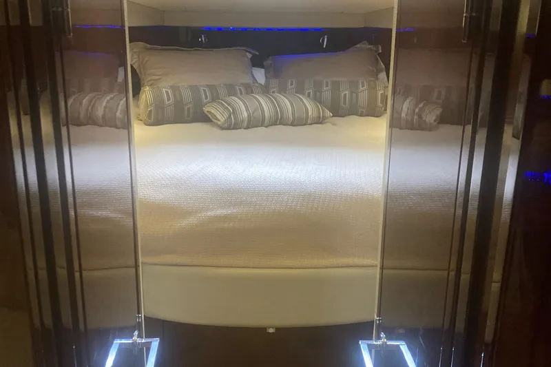 Slide: The Image of Luxurious bedroom interior of 2015 Sea Ray 450 Sundancer yacht with elegant bedding. - 15