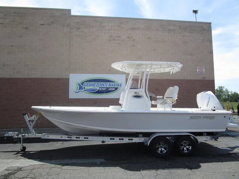 The Image of 2025 Sea Pro 230 DLX BAY boat on trailer at Grand Pointe Marina. - 1