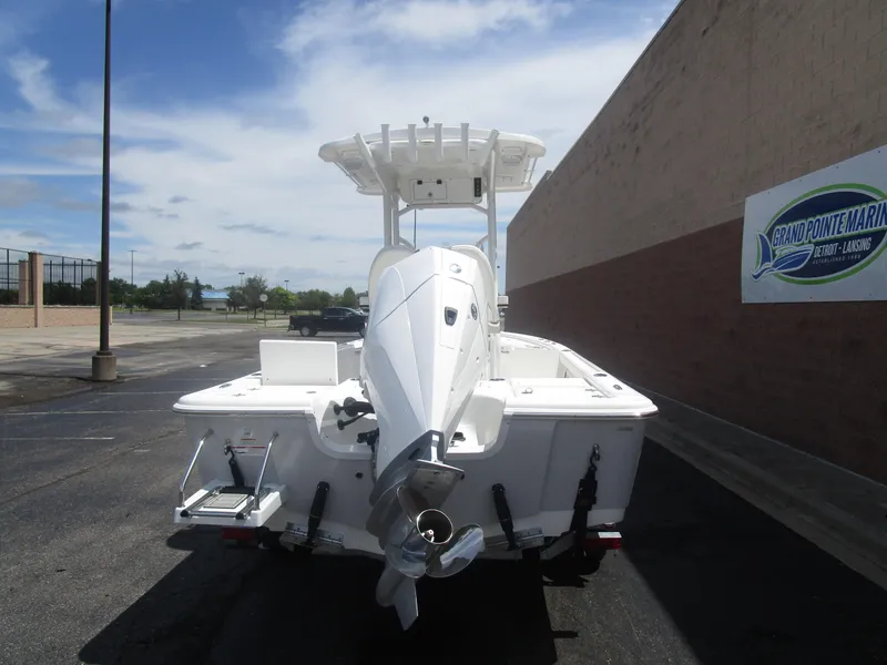 Slide: The Image of 2025 Sea Pro 230 DLX BAY boat, rear view, parked at Grand Pointe Marina. - 3