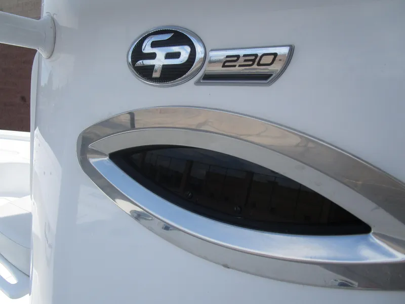 Slide: The Image of 2025 Sea Pro 230 DLX BAY boat emblem and design detail. - 7
