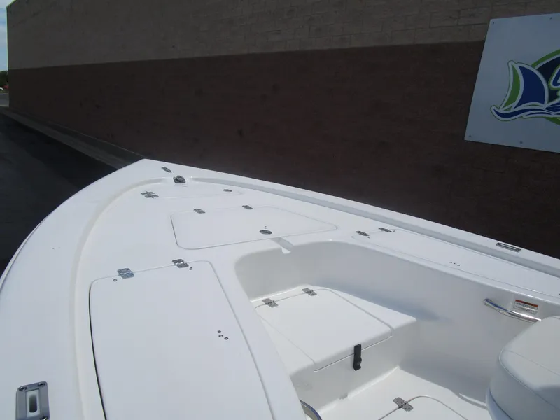 Slide: The Image of 2025 Sea Pro 230 DLX BAY boat deck with storage compartments. - 8