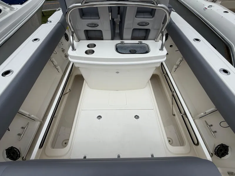 Slide: The Image of 2026 Boston Whaler 250 Outrage boat interior with seating and storage compartments. - 14