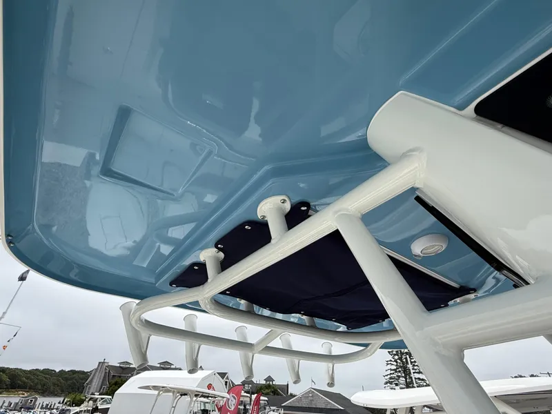 Slide: The Image of Boston Whaler 250 Outrage 2026 boat canopy and rod holders, viewed from below. - 23
