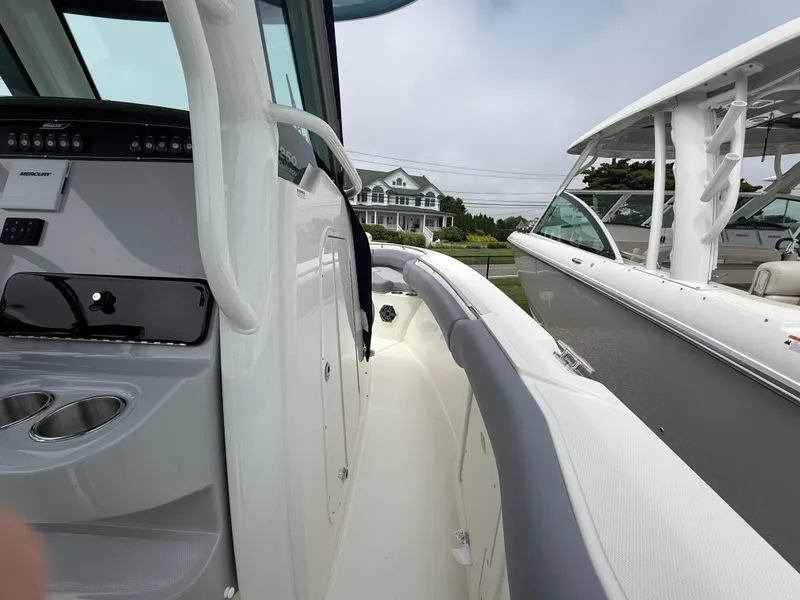 Slide: The Image of 2026 Boston Whaler 250 Outrage boat interior with modern design and controls. - 24