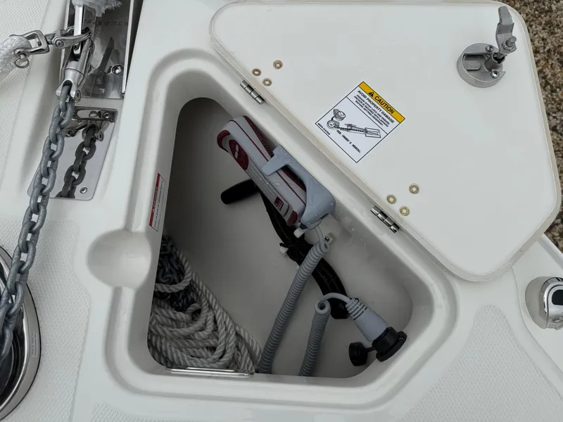 Slide: The Image of Anchor storage compartment on a 2026 Boston Whaler 250 Outrage boat. - 34