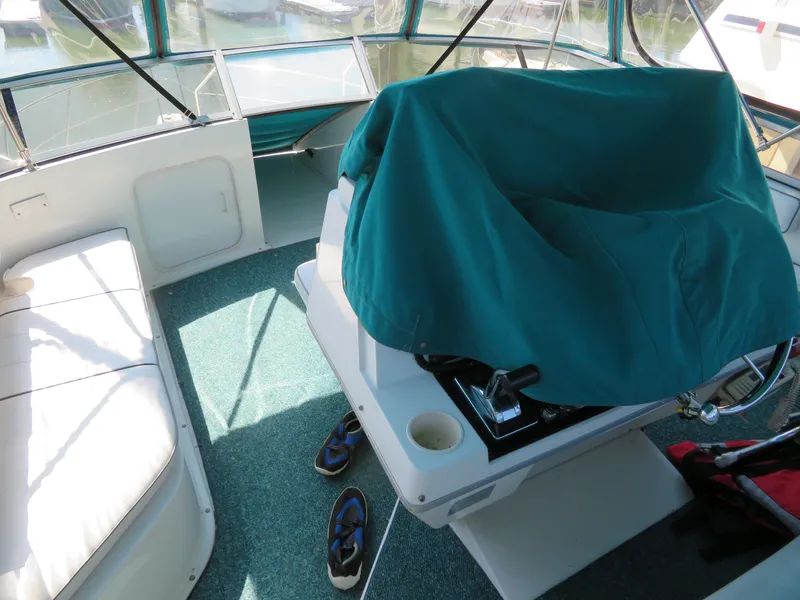 Slide: The Image of 1994 Carver 380 Santego boat interior with covered helm and seating area. - 5