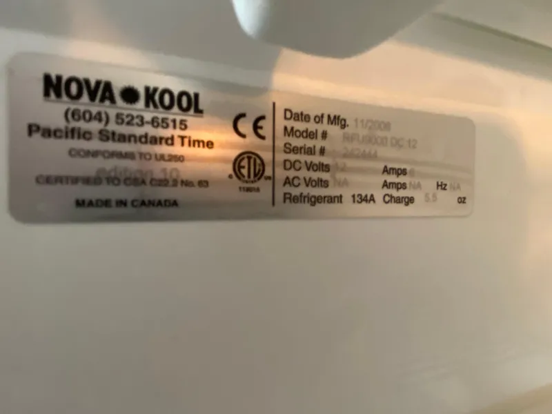 Slide: The Image of Label on Nova Kool refrigerator, model RFU9000 DC 12, manufactured in 2006, made in Canada. - 50