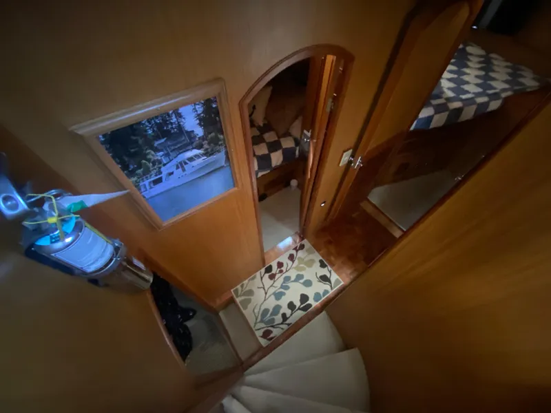 Slide: The Image of Interior of 1982 C & L Sea Ranger yacht with wooden paneling and cozy cabin spaces. - 63