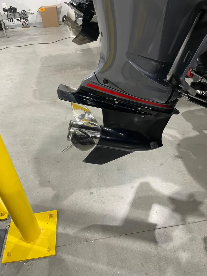 Slide: The Image of 2020 Skeeter FXR 21 Limited boat motor in a garage setting. - 11