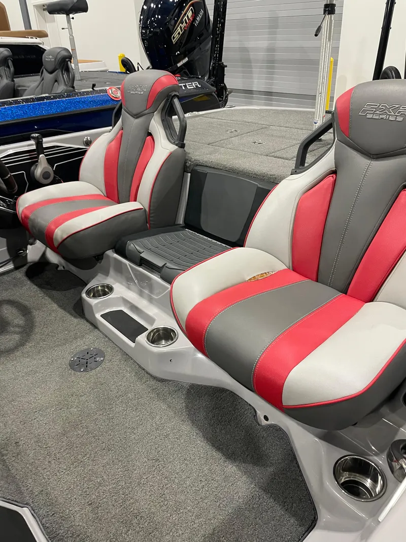 Slide: The Image of 2020 Skeeter FXR 21 Limited boat interior with red and gray seats, showcasing modern design. - 13