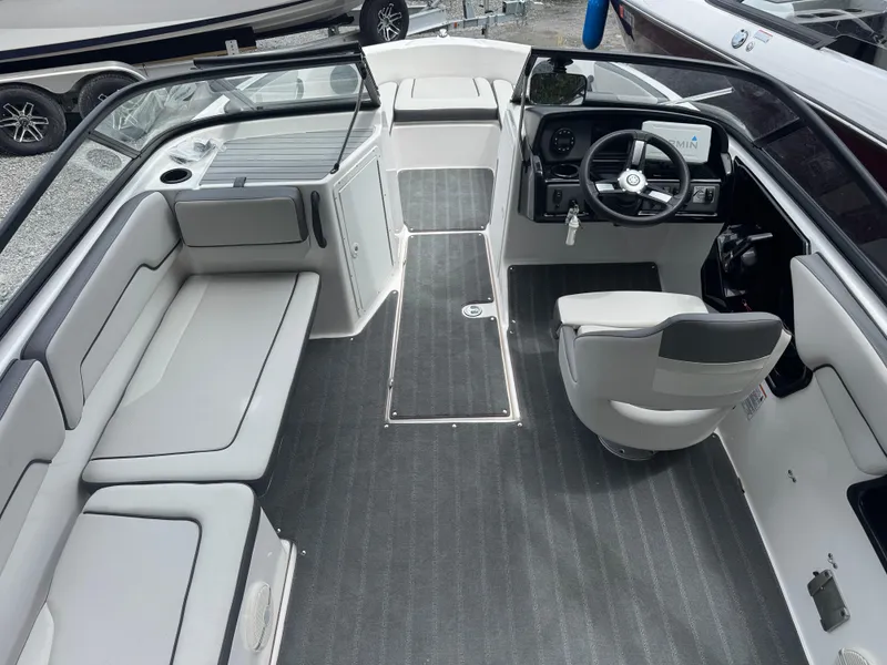 Slide: The Image of 2023 Yamaha Boats AR190 interior with seating, steering wheel, and dashboard. - 3