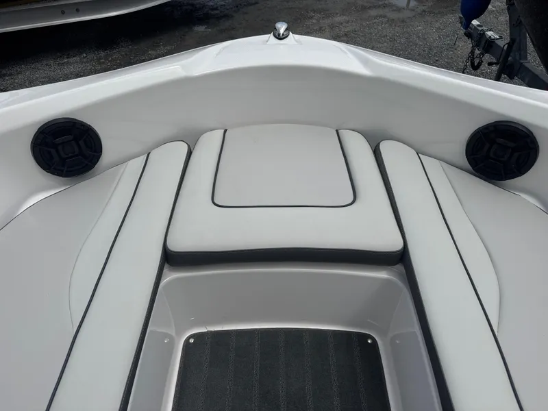 Slide: The Image of 2023 Yamaha AR190 boat interior with cushioned seating and built-in speakers. - 5