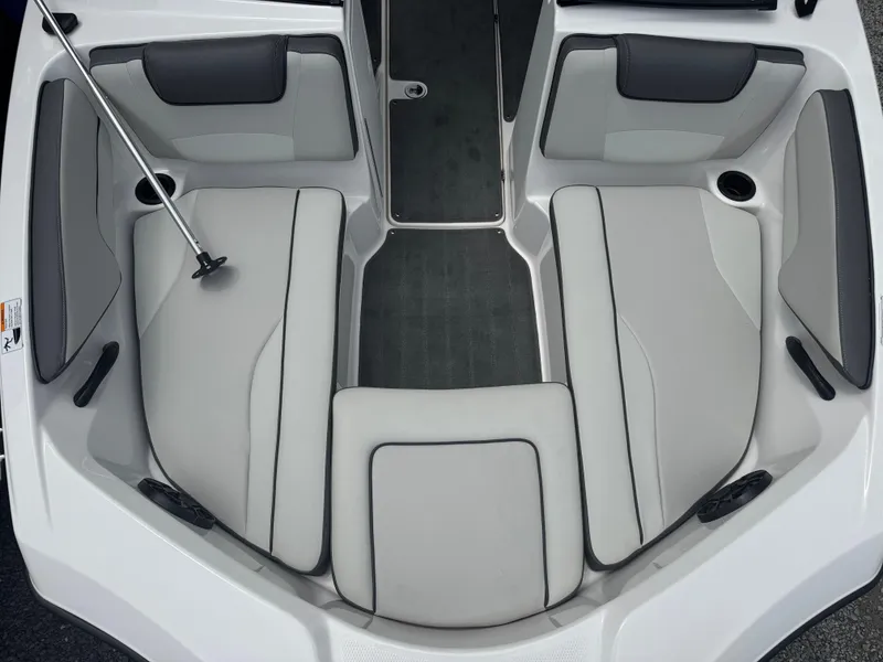 Slide: The Image of 2023 Yamaha AR190 boat interior with gray seating and cup holders. - 6