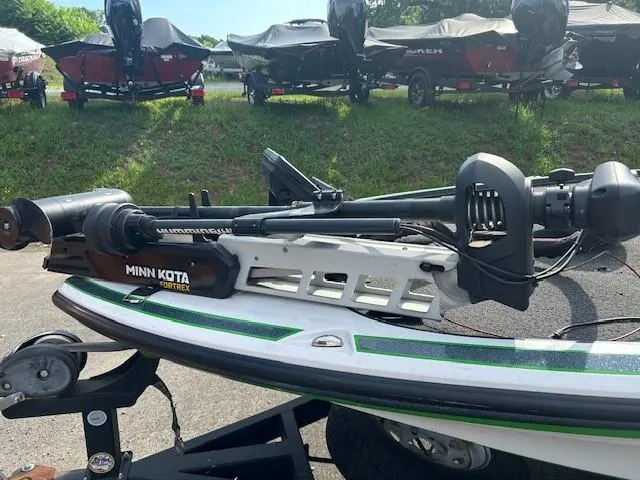 Slide: The Image of 2018 Nitro Z19 boat with Minn Kota Ultrex trolling motor, parked on a trailer. - 11