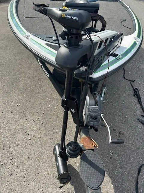 Slide: The Image of 2018 Nitro Z19 boat with Minn Kota trolling motor on a concrete surface. - 4