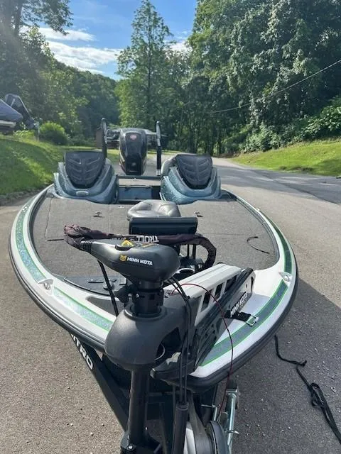 Slide: The Image of 2018 Nitro Z19 boat on road, surrounded by lush greenery and clear sky. - 5