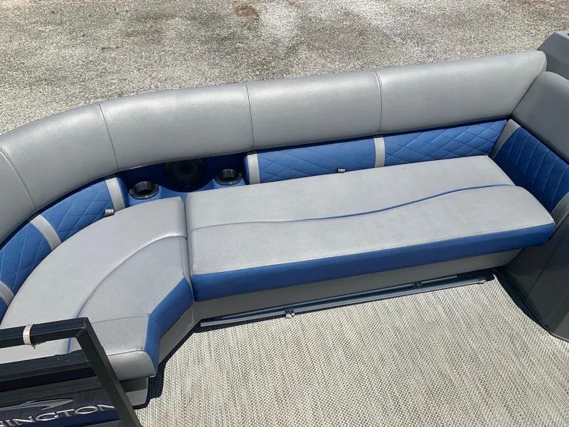 Slide: The Image of 2021 Bennington 24 LSR boat interior with blue and gray seating. - 12