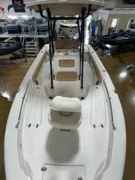 Slide: The Image of 2024 Sea Chaser LX boat, white interior, center console, showroom display. - 4
