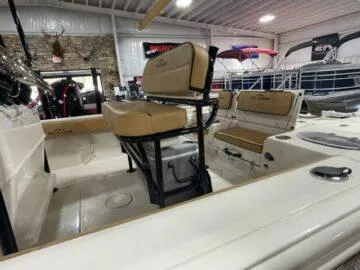 Slide: The Image of 2024 Sea Chaser LX boat interior with tan seating and modern design. - 8