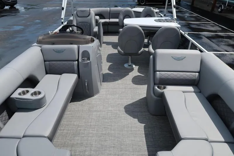Slide: The Image of 2024 Bennington L Entertainment 23 LPD pontoon boat interior with luxurious seating and table. - 11