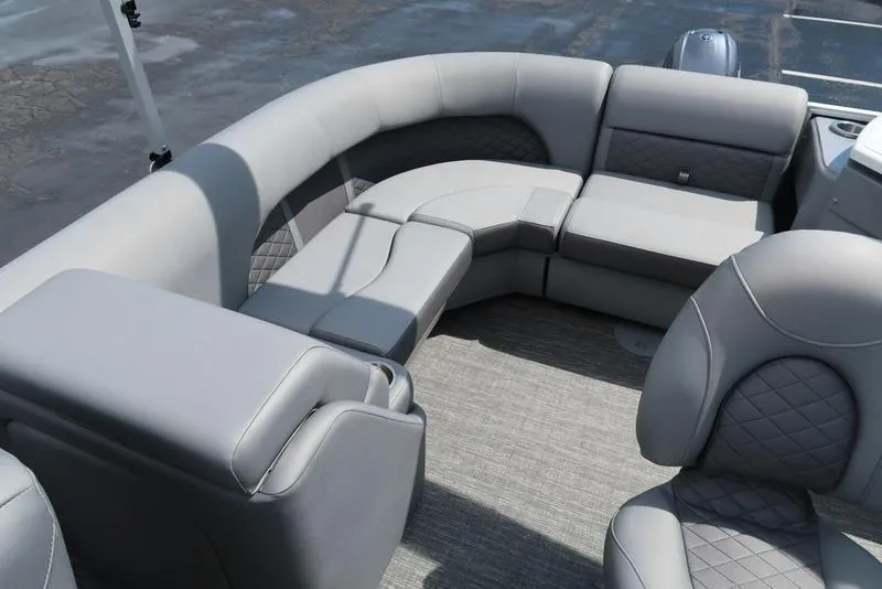 Slide: The Image of 2024 Bennington L Entertainment 23 LPD pontoon boat interior with luxurious gray seating. - 13