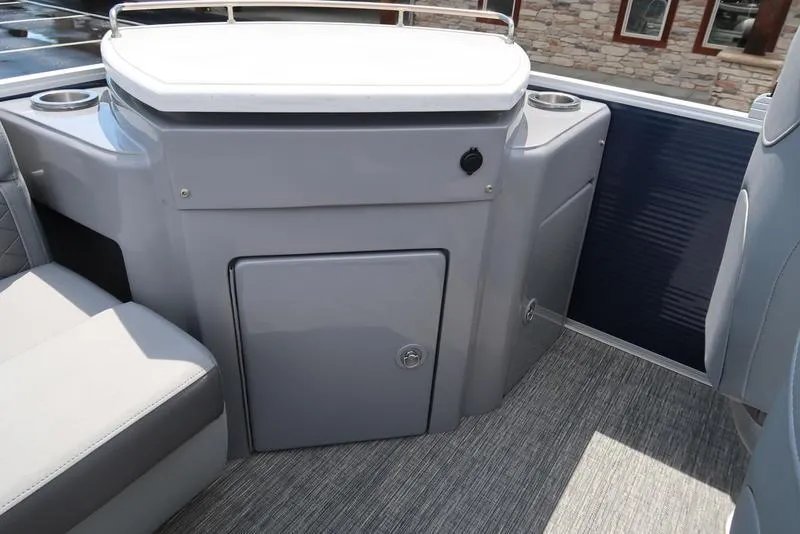 Slide: The Image of 2024 Bennington L Entertainment 23 LPD boat interior with seating and storage. - 14