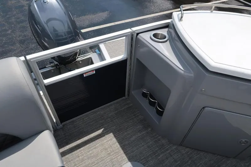 Slide: The Image of 2024 Bennington L Entertainment 23 LPD boat interior with seating and storage compartments. - 16