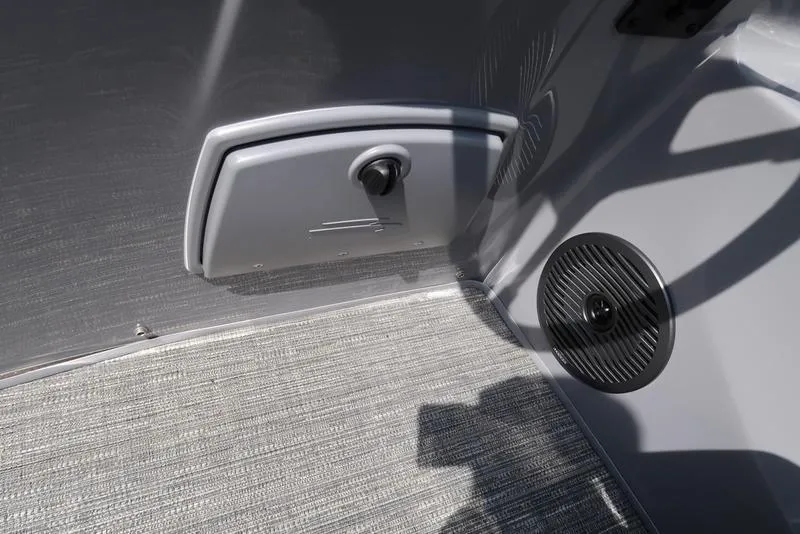 Slide: The Image of 2024 Bennington L Entertainment 23 LPD interior detail with speaker and storage compartment. - 19