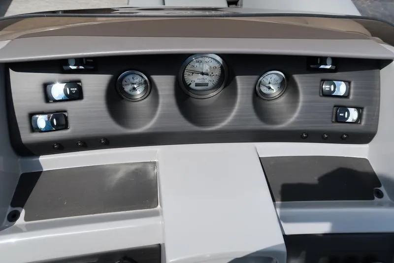 Slide: The Image of 2024 Bennington L Entertainment 23 LPD dashboard with gauges and controls. - 20