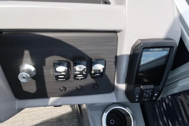 Slide: The Image of 2024 Bennington L Entertainment 23 LPD dashboard with controls and Garmin device. - 21