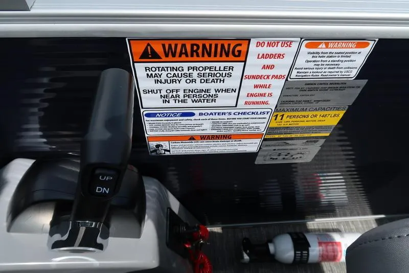 Slide: The Image of 2024 Bennington L Entertainment 23 LPD warning labels and controls, emphasizing safety instructions. - 24