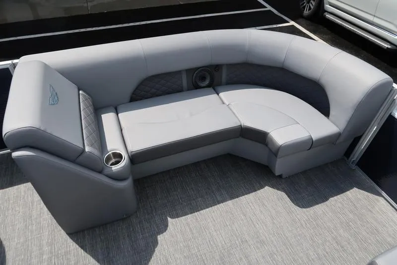Slide: The Image of 2024 Bennington L Entertainment 23 LPD boat seating with gray upholstery and cup holder. - 26