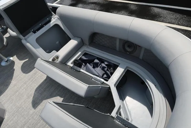 Slide: The Image of 2024 Bennington L Entertainment 23 LPD boat interior with open storage compartments. - 28