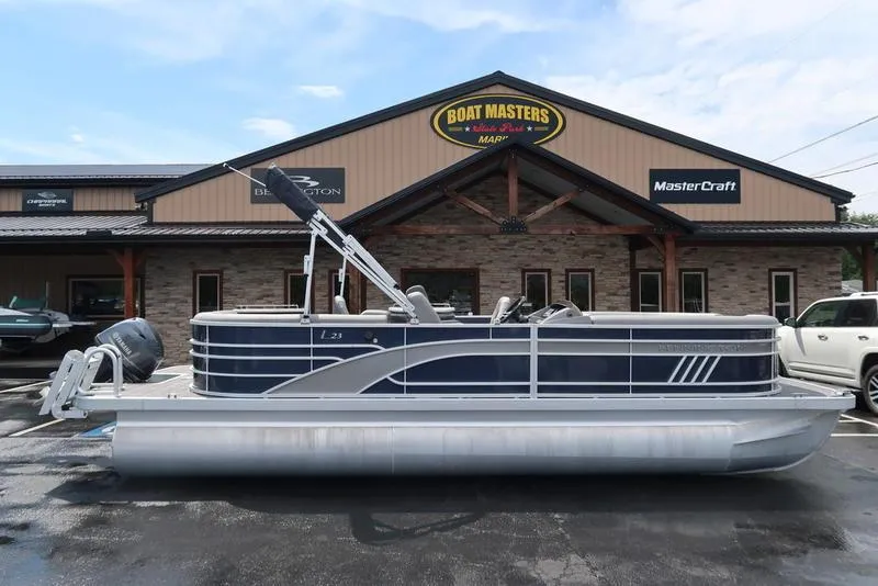 Slide: The Image of 2024 Bennington L Entertainment 23 LPD pontoon boat displayed at Boat Masters dealership. - 3