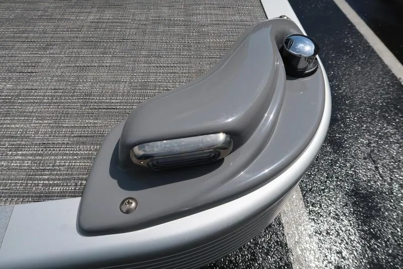 Slide: The Image of 2024 Bennington L Entertainment 23 LPD boat detail with sleek gray finish and light fixture. - 34