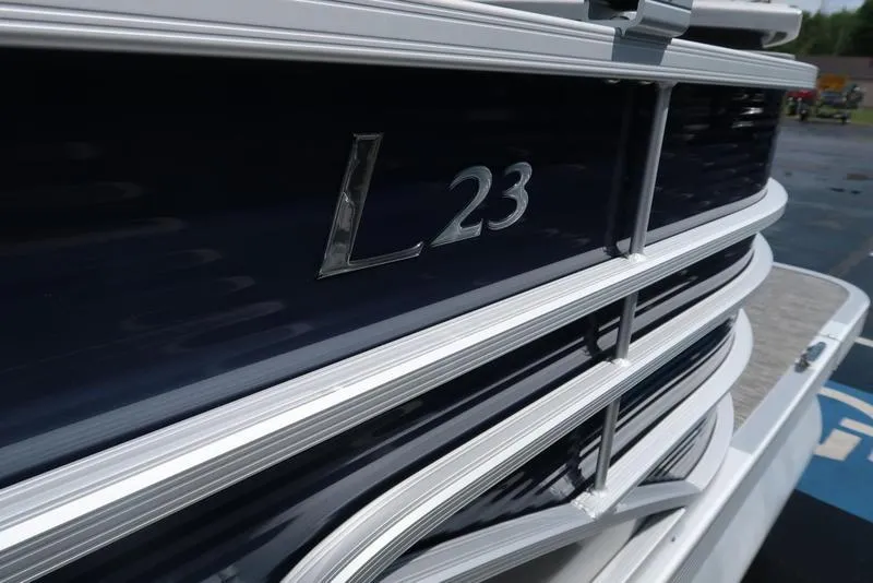 Slide: The Image of 2024 Bennington L Entertainment 23 LPD pontoon boat, close-up of sleek exterior design. - 7