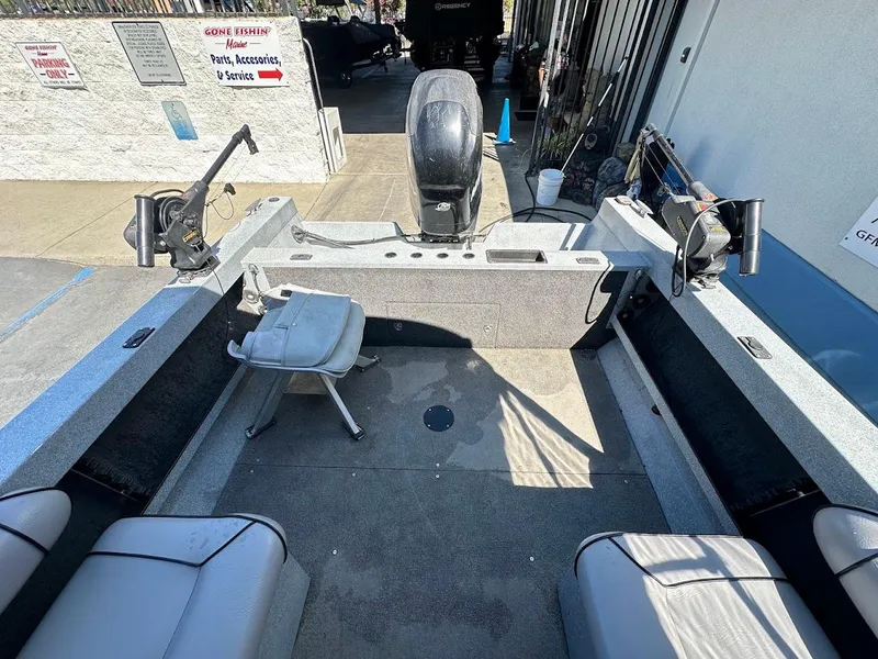 Slide: The Image of Interior of a 2008 Jetcraft 1925 Adventurer boat with fishing equipment and seating. - 13