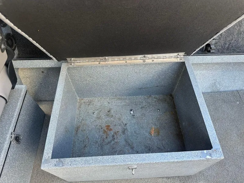 Slide: The Image of Open storage compartment in a 2008 Jetcraft 1925 Adventurer boat. - 26