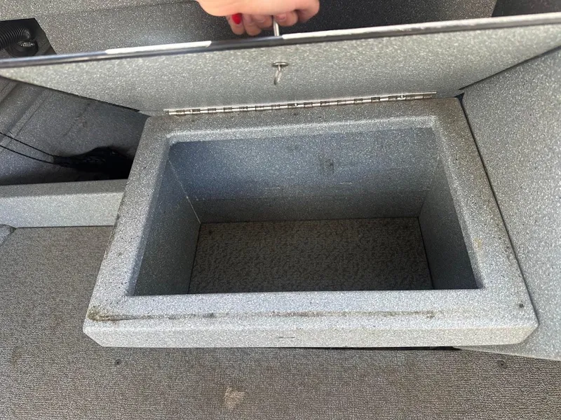 Slide: The Image of Open storage compartment in a 2008 Jetcraft 1925 Adventurer boat. - 32